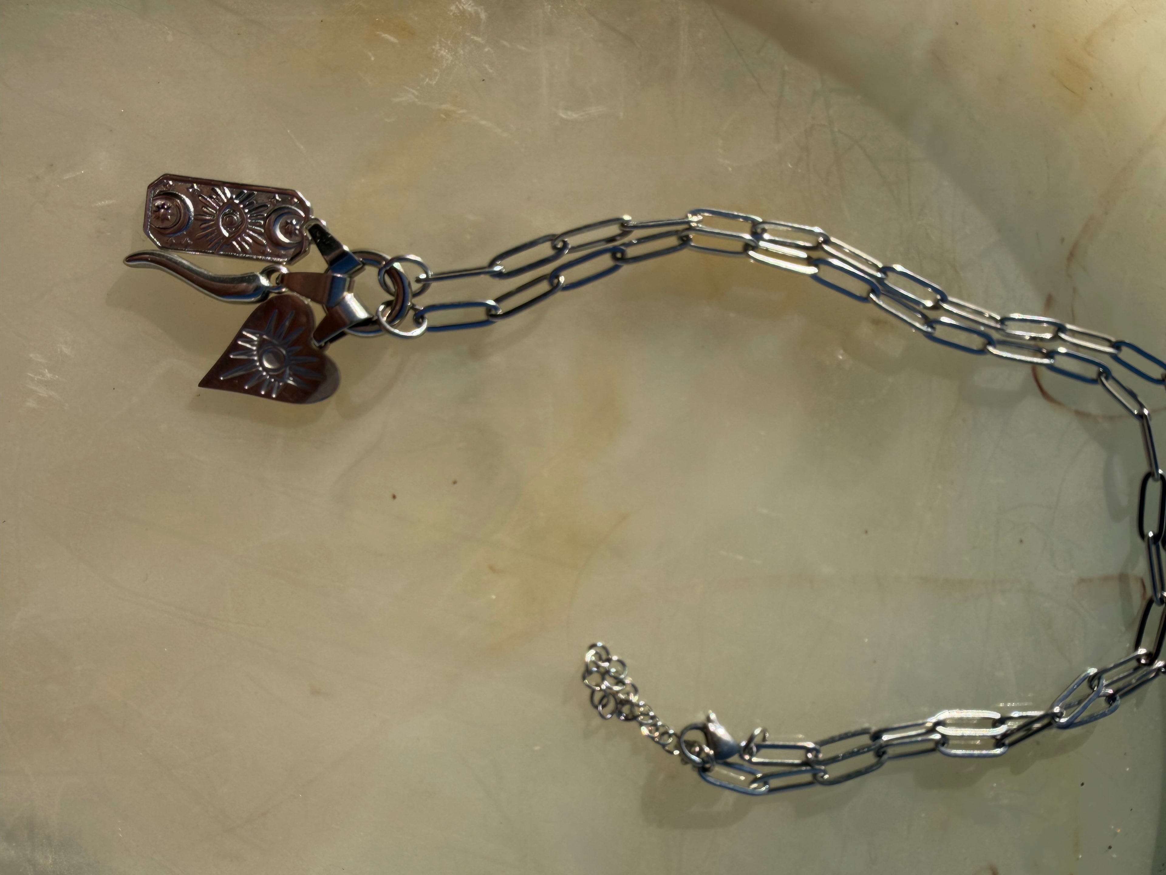 Long heart evil eye charm